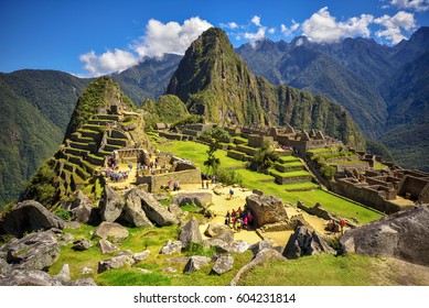 View Of The Lost Incan City Of Machu Picchu Near Cusco, Peru. Machu Picchu Is A Peruvian Historical Sanctuary. People Can Be Seen On Foreground.