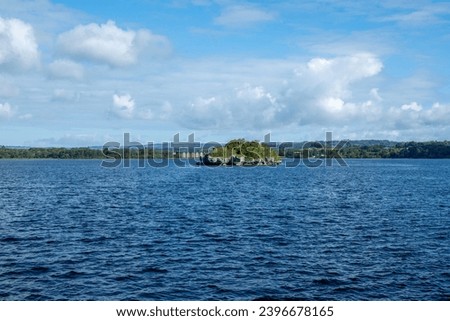 View of the Lough Leane lake and an island in the middle of the lake in Killarney National Park