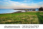 View of Low Newton and Sandy Bay, also known as Low Newton-by-the-sea it is a small fishing village on the North Sea coastline in Northumberland