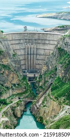 View Of The Lower Part Of The Arch Dam With A Spillway In The Canyon