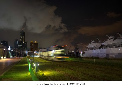 The View Of LRT (light Rail Transit) In Kaohsiung City, Taiwan. When It Passes At Night. You Can Also See 85 Sky Tower Far Away In This Photo.
