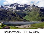 View from Lukmanierpass on the St. Mary Lake in GraubÃ?Â¼nden, Switzerland, the lake is surrounded by mountains over 3,000 meters/Dam lake at Lukmanierpass in GraubÃ?Â¼nden, Switzerland