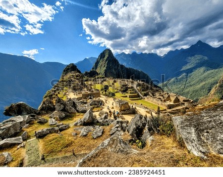 View of Machu Picchu in a partially cloudy day 