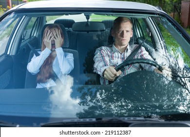 View Of Mad Couple In A Car