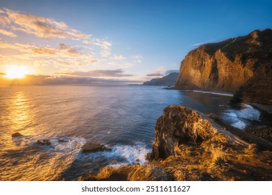 View of Madeira scenic cliffs coastline landscape on sunrise, Guindaste viewpoint, Madeira island, Portugal - Powered by Shutterstock