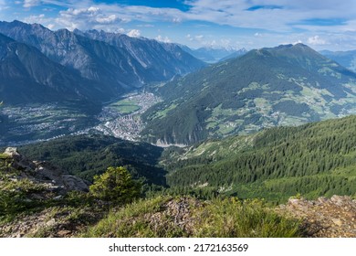 View of magnificent mountain panorama of the Austrian Alps in Tyrol with view of the valley basin of Landeck under partly cloudy blue sky