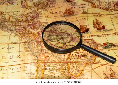 View of a magnifying glass on a map of the Old World, America - Shutterstock ID 1798028098