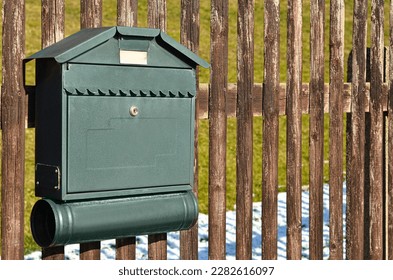 View of mailbox on wooden fence - Shutterstock ID 2282616097