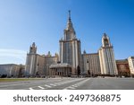 View of the main building of Moscow State University. High-rise building with a spire. Skyscraper in neoclassical style. Architectural dominant and landmark of Moscow. Higher education in Russia.