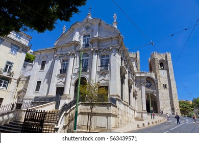 View Of The Main Facade Of Santo Antonio Church (Igreja De Santo Antonio) With The Lisbon Cathedral (Se De Lisboa) On Background. Lisbon, Portugal