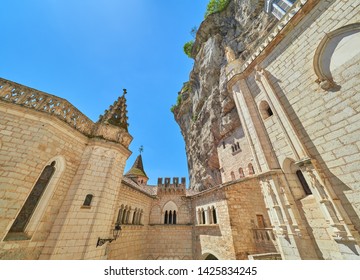 View Of The Main Square Atrium Of Saint Sauveur And Blessed Virgin Mary Sanctuary And Chapels In The Medieval French Village Of Rocamadour, Lot, Quercy, France. UNESCO World Heritage Site.