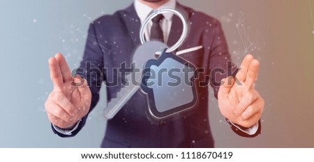 View of a Man holding a Key and house 3d rendering