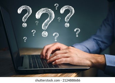 View Of A Man Holding A Technology Question Mark Icon