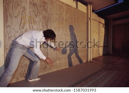 Similar – Image, Stock Photo man playing basketball shadow silhouette in the street