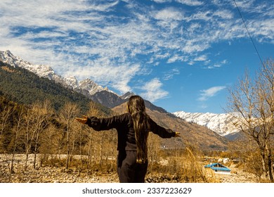 View at Manali, Himachal Pradesh, India. Beas river along side Manali snow mountains Himachal Pradesh, India. Manali is the best destination for honeymoon and holidays. Green nature in Manali, India.