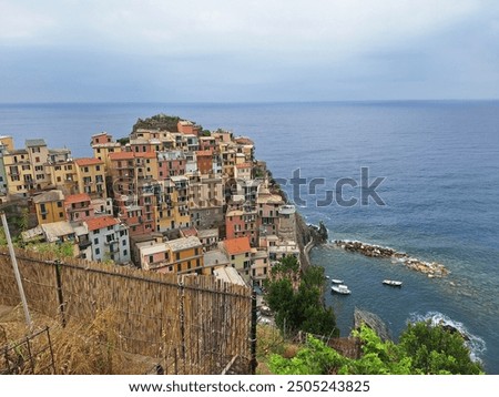 Similar – Image, Stock Photo Manarola is one of the most beautiful villages in Italy. The Cinque Terre is a rugged coastline of the Ligurian Riviera and is made up of five beautiful hilltop villages.