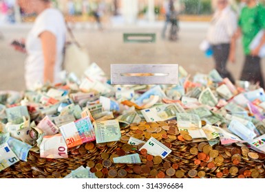 View Of Many Paper Money Inside The Plexiglass Cube For Fundraising 