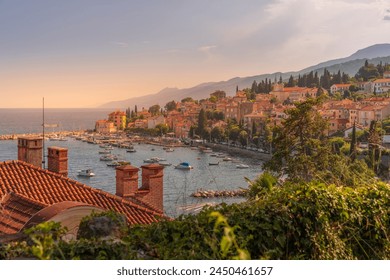 View of marina, rooftops and bay from elevated position in Volosko, Opatija, Kvarner Bay, Croatia, Europe