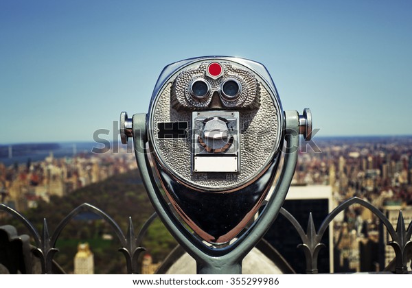 View\
master binoculars looking out on Istanbul\
skyline