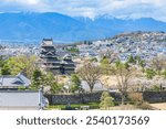 View of the Matsumoto-jo (Matsumoto Castle), National Treasure of Japan, and Matsumoto City, Nagano Prefecture.