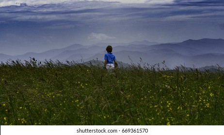 The View From Max Patch, A Bald On The Appalachian Trail That Straddles Tennessee And North Carolina, In The Great Smoky Mountains National Park. A Child Is Hiking With His Family.