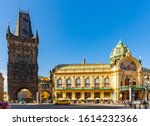 View of medieval Gothic Powder Tower (Powder Gate) connected by open arched bridge to impressive Municipal House on Republic Square in Prague, Czech Republic
