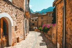 View Of A Medieval Street In The Old Town Of The Picturesque Spanish-style Village Fornalutx, Majorca Or Mallorca Island.