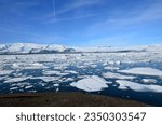 View of melting ice flow with icebergs in a lagoon in Iceland.