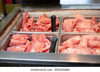 A View Of A Metal Pans Full Of Frozen Beef Slices, Seen At A Local Mongolian BBQ Restaurant.