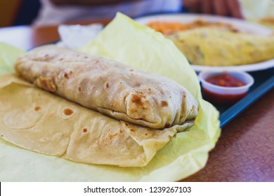 View of mexican burrito roll on a plate
