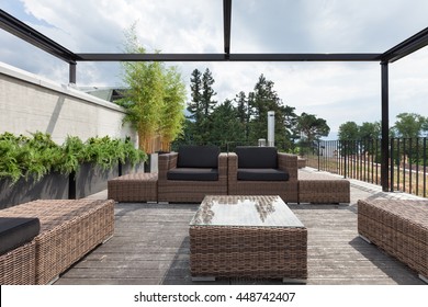 View Of A Modern Patio With Comfortable Garden Furniture