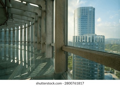 View of Modern Skyscraper Through Concrete Structure