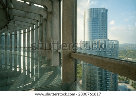 View of Modern Skyscraper Through Concrete Structure
