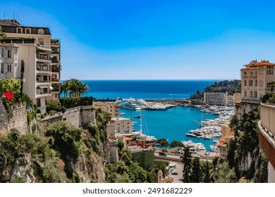 View of Monaco City with boat marina below in Monaco. Monaco City is one of the four traditional quarters. - Powered by Shutterstock