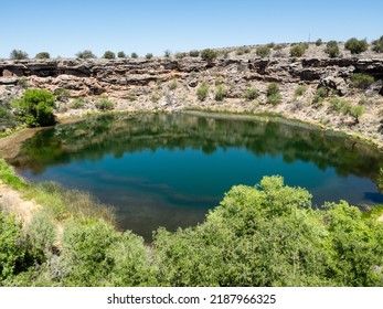 View of Montezuma Well with cliff dwellings visible in the upper left corner - Arizona, USA