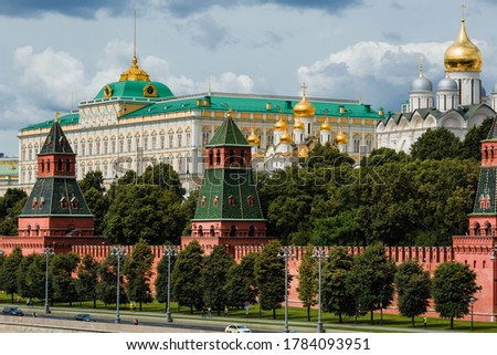 View of Moscow on a summer day. capital of Russia. Grand Kremlin palace. Church Of The Kremlin. Kremlin embankment. river Moscow. Popular tourist attraction. Business card of Moscow.