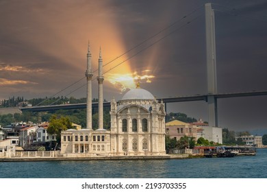 View Of Ortaköy Mosque From The Bosphorus In Istanbul. Background Cloudy Sky