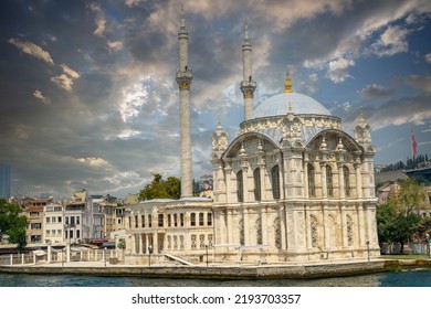 View Of Ortaköy Mosque From The Bosphorus In Istanbul. Background Cloudy Sky