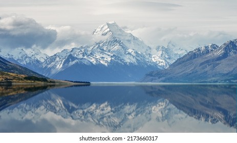 The View Of Mount Everest Covered In Thick Snow With The Reflection Of The Mountain On The Lake Makes It Even More Beautiful
