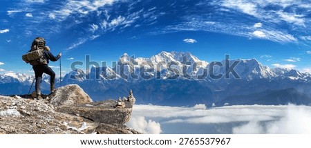 View of mount Kangchenjunga 8586 m with climber and beautiful clouds on sky from Eastern Nepal, the higgest mount of India and third highest mountain in the world, Nepal Himalaya mountain
