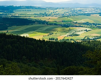 View From Mountain In Central Sudetes. Landscape With Fields And Blue Sky