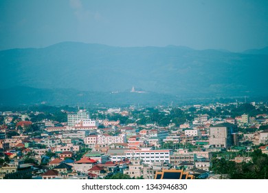 View from mountain in city with mountain background.