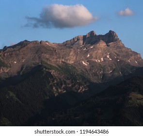 view of a mountain and clouds