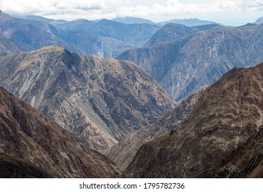 View Of The Mountain Landscape With A Pile Of Rocks, Gorges And Steep Slopes. Landscape And Nature In Autumn In A Complex Mountain Range. 