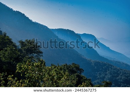 View of mountain layers and low hanging clouds during sunset, clouds with fog. Smoky Layers Upon Layers in late autumn in the Smokies.  Yercaud, Salem, Tamilnadu. India.