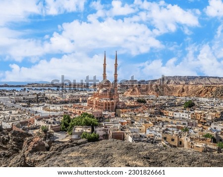 View from the mountain to the old city of Sharm El Sheikh in the valley with the Red Sea on the horizon, Egypt. Exotic urban panorama of Egyptian tourist town