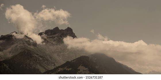 view of a mountain peak and clouds