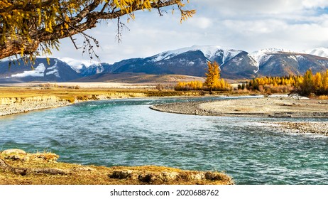 View of the mountain range and the river on autumn sunny day