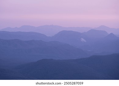 The view of the mountain range at sunset. View of the mountains from high in the evening. Sunset view of the mountain range. - Powered by Shutterstock