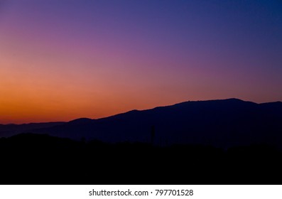 view of mountain silhouette on twilight sky after sunset - Powered by Shutterstock